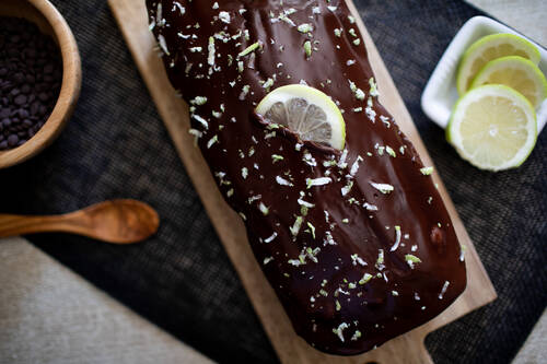 A chocolat cake with some lemon on the top